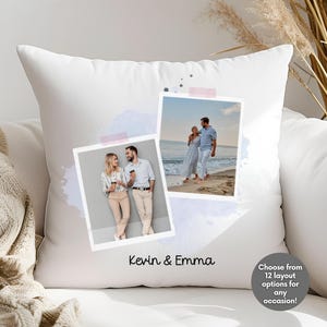 May include: White decorative pillow featuring two framed photos, one with a couple holding drinks and the other with a couple walking on a beach. The pillow has a watercolor design and the text "Kevin & Emma".