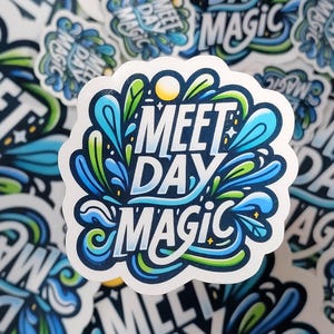2" 'Meet Day Magic' sticker in vibrant, playful lettering, capturing the excitement and energy of swim meet days and the special moments that make them memorable.