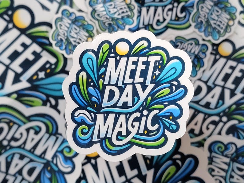 2" 'Meet Day Magic' sticker in vibrant, playful lettering, capturing the excitement and energy of swim meet days and the special moments that make them memorable.