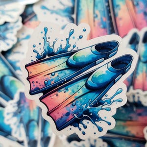 A 2" playful swim sticker featuring a graphic of swim fins, symbolizing the power and speed of swimmers as they glide through the water with style and precision.
