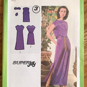 May include: Simplicity sewing pattern number 9033 for a dress. The pattern includes three pieces and is for a miss size 12. The pattern shows a purple dress with a slit on the side and a gold belt. The dress is shown on a model with a light background.