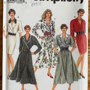 May include: Simplicity sewing pattern number 8114, size P (12-16), for a dress with a wrap style. The pattern includes four different styles: a white dress with floral print, a black and white polka dot dress, a black and white striped dress, and a red dress.