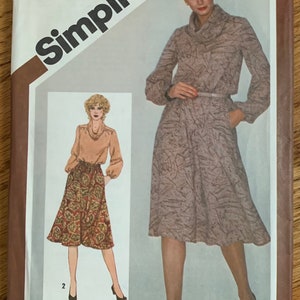 May include: Simplicity sewing pattern number 9777 for a dress with a cowl neck and a skirt. The pattern is marked for adjustments to Miss Petite sizes. The pattern is $2.50.