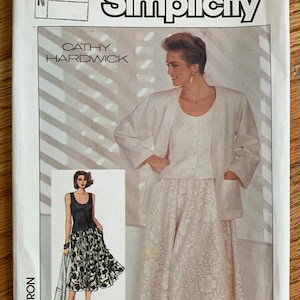 May include: Simplicity sewing pattern envelope for a skirt and jacket. The pattern number is 6882 and the size is 10-12-14. The designer is Cathy Hardwick.
