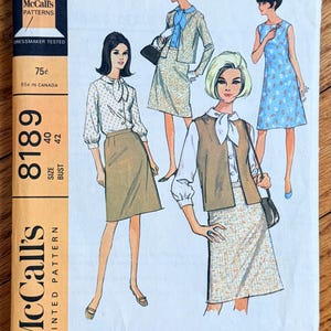 May include: Vintage McCall's sewing pattern 8189 featuring illustrations of women's fashion designs. The pattern includes a variety of outfits, including dresses, skirts, and jackets. The cover has text that reads "WARDROBE IN WOMEN'S SIZES AND MISSES' AND WOMEN'S HALF SIZES."