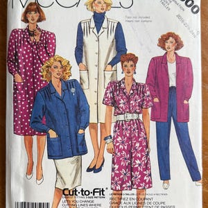May include: McCall's sewing pattern featuring various women's fashion designs. The cover showcases illustrations of outfits, including a long white coat, a pink floral dress, and a blue jacket. The pattern includes size combinations and the text "Cut-to-Fit".