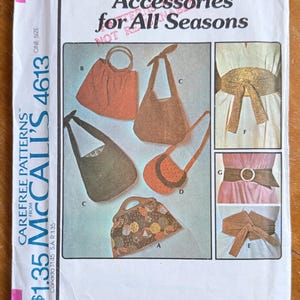 May include: A vintage McCall's sewing pattern titled "Accessories for All Seasons." The pattern features illustrations of various bags and belts, including handbags, shoulder bags, and waist belts. The pattern cover is white with pink accents.