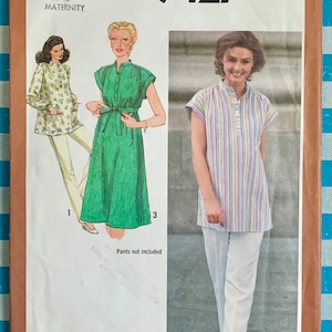 May include: Simplicity sewing pattern number 9427 for maternity wear. The pattern includes instructions for making two tops, one with a green solid fabric and the other with a striped fabric. The pattern is size 12.
