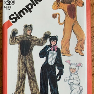 May include: Simplicity sewing pattern number 5739 for adult-sized animal costumes. The pattern includes instructions for making a lion, bear, cat, and bunny costume.