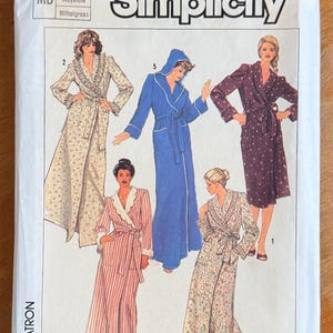 May include: Simplicity pattern envelope featuring illustrations of five different robes. The robes vary in color and pattern, including floral, striped, and solid options. The envelope has the number 7655 and the size Medium.
