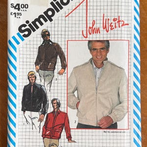 May include: A Simplicity 5708 sewing pattern envelope for a jacket by John Weitz, size 40. The cover features illustrations of four jacket variations in brown, black, red, and beige, with a grid background and blue striped borders.