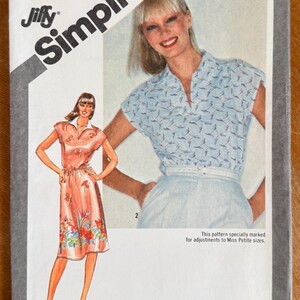 May include: A vintage Simplicity sewing pattern, size 12 Miss, featuring illustrations of two women's outfits. One woman is wearing a light blue top and white skirt, the other a floral dress. The pattern number is 9917.