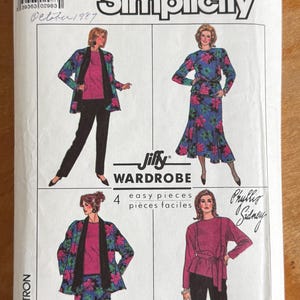 May include: A Simplicity Jiffy Wardrobe sewing pattern envelope 8344, size R, featuring illustrations of four clothing combinations including a floral jacket, solid top, skirt, and trousers. The white paper envelope includes text and a barcode.