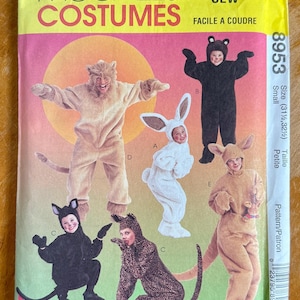 May include: A McCall's Costumes sewing pattern envelope, number 8953, size Small. The front features illustrations of five different animal costumes: a lion, a black bear, a white rabbit, a black cat, and a leopard, plus a kangaroo costume.