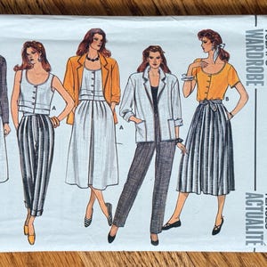May include: Vintage Butterick sewing pattern featuring illustrations of women's outfits. The cover displays drawings of various ensembles, including blazers, skirts, and pants. The text on the cover reads "Today's Wardrobe" and "Tenues Actualité".
