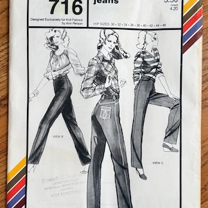 May include: A vintage Stretch & Sew 716 sewing pattern envelope for designer jeans, featuring illustrations of three different styles of pants and tops. The white paper envelope includes text, hip sizes 30-46, and colorful diagonal stripes.