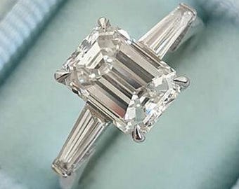 3.00 Carat Emerald Cut Three Stone Moissanite Diamond Engagement Ring, Side Tapper Baguettes 14k White Gold