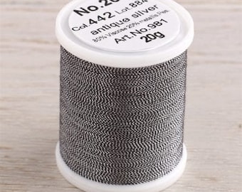 May include: A spool of No. 20 antique silver thread, labeled Col. 442 Lot. 884, 80% Viscose 20% metallic fibers, Art. No. 981, 20g.