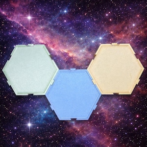 May include: Three hexagonal panels in pastel colors: light green, blue, and beige. The panels are arranged against a backdrop of a vibrant galaxy with stars and nebulae. The panels appear to be connected.