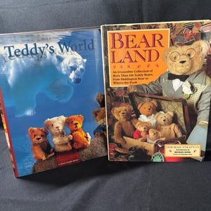 May include: Two hardcover books. One titled "Teddy's World" features a polar bear illustration. The other, "BEAR LAND," has a bear wearing glasses and a bow tie. The cover also shows a collection of teddy bears.