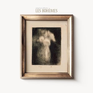 May include: A framed black and white art print featuring a charcoal drawing of a vase with flowers. The artwork is set in a gold-colored frame. The text "curated art collective LES BOHEMES" is at the top.