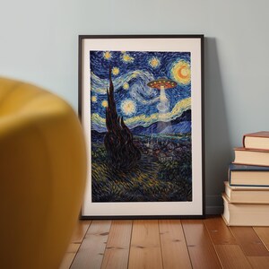 May include: Framed art print depicting a starry night scene with a UFO hovering above a village. The artwork features a dark, swirling sky with yellow stars and a crescent moon. The print is in a black frame and is propped against a light blue wall.