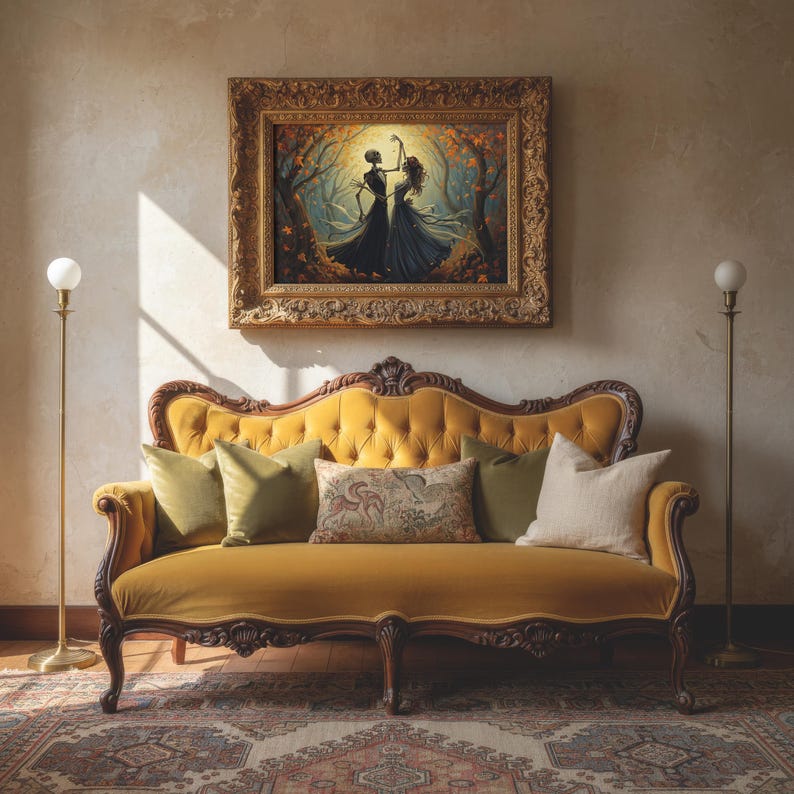 May include: A mustard yellow velvet tufted sofa with a curved wooden frame, featuring two olive green pillows, one beige pillow, and one patterned rectangular pillow, positioned beneath a framed painting of two figures dancing in a forest.