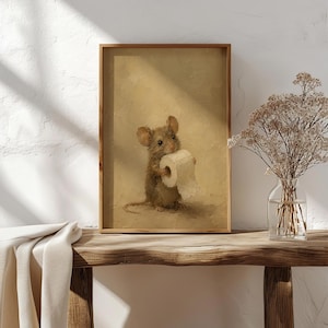 May include: A framed wall art print featuring an oil painting of a small brown mouse holding a white roll of toilet paper. The mouse is centered against a textured, monochromatic beige background, rendered with visible brushstrokes.