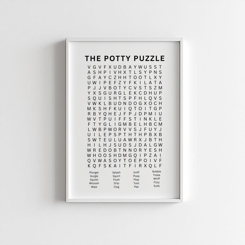 May include: A framed print titled "THE POTTY PUZZLE" features a word search grid with related words like "flush" and "pee." The print is in black and white, with a white border.