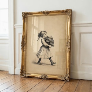 May include: A framed wall art piece featuring a black and white sketch of a young person with hair tied back, wearing a dress and boots, walking while carrying a tall stack of thick books. The artwork is encased in an ornate gold frame.