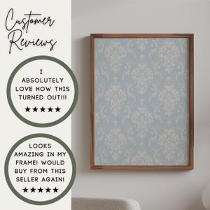 May include: A framed wall art print featuring a light blue background with a repeating cream-coloured damask pattern. The text on the left reads Customer Reviews, I ABSOLUTELY LOVE HOW THIS TURNED OUT!!!, and LOOKS AMAZING IN MY FRAME! WOULD BUY FROM THIS SELLER AGAIN! with five-star icons.