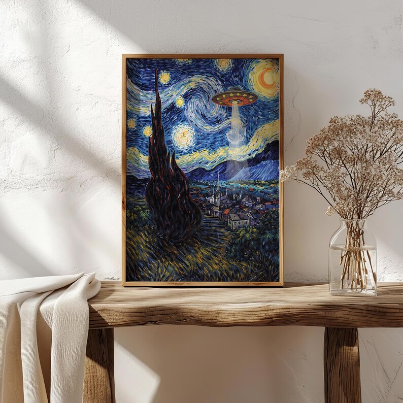 May include: A framed print of Van Gogh's "Starry Night" with a UFO hovering over a village. The artwork features a swirling blue night sky with yellow stars and a crescent moon. The UFO emits a bright beam of light.