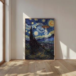 May include: Framed print of a reimagined "Starry Night" painting. The artwork features a swirling night sky with a UFO beaming light down on a village. The print is in a wooden frame and leans against a white wall.