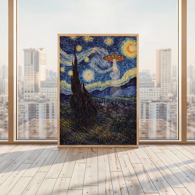 May include: A framed print of Van Gogh's "Starry Night" with a UFO hovering above the village. The artwork features swirling blue and yellow brushstrokes, a tall dark tree, and a crescent moon. The frame is made of light-colored wood.