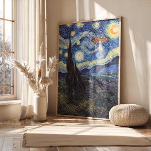 May include: A framed print of Van Gogh's "Starry Night" with a UFO replacing the moon. The artwork features a swirling blue night sky, a dark tree, and a village. The frame is a light brown color.