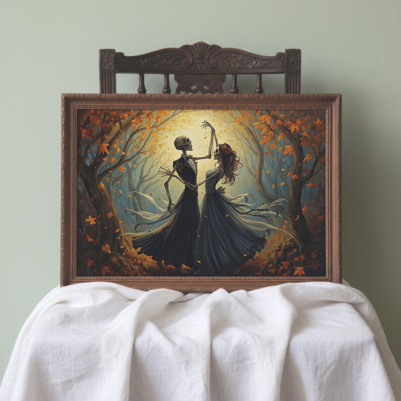 May include: A framed rectangular wall art print depicting two skeletons in formal attire dancing in an autumn forest. The figures are surrounded by orange and yellow falling leaves, with a bright light source behind them, all encased in a brown frame.