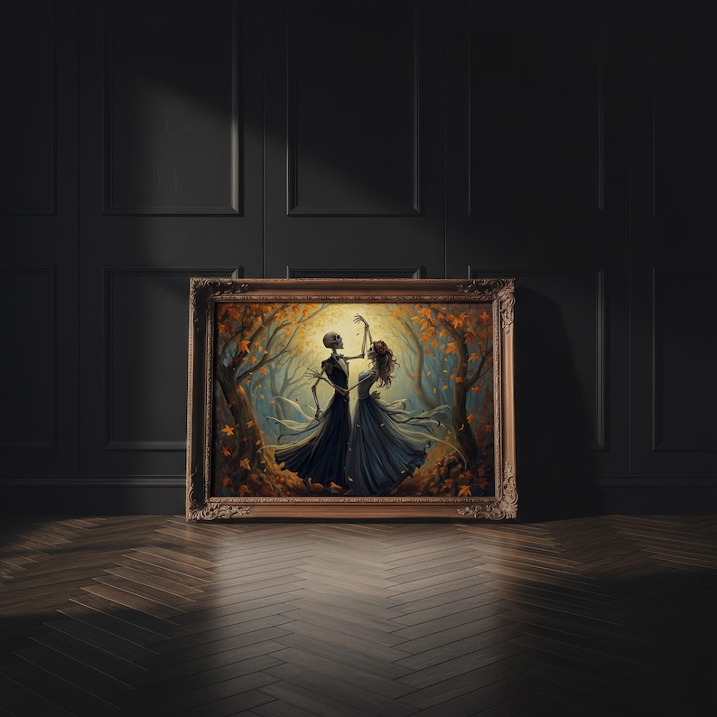 May include: A framed rectangular wall art piece depicting two skeletons dancing in a forest filled with orange and brown autumn leaves. The skeletons are wearing dark formal attire, with one in a suit and the other in a flowing gown, set against a glowing golden background.