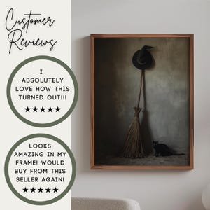May include: A framed wall art print featuring a black witch hat hanging above a wooden broomstick, with a black cat sitting on the floor. The text reads: Customer Reviews, I ABSOLUTELY LOVE HOW THIS TURNED OUT!!!, LOOKS AMAZING IN MY FRAME!