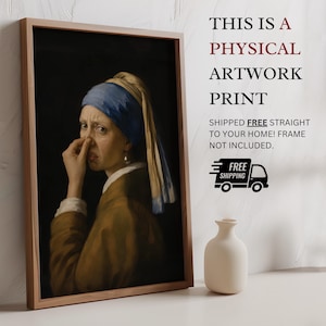 May include: A framed artwork print featuring a parody of the Girl with a Pearl Earring, showing a person holding their nose with a disgusted expression. The text reads: THIS IS A PHYSICAL ARTWORK PRINT SHIPPED FREE STRAIGHT TO YOUR HOME! FRAME NOT INCLUDED.