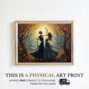 May include: A framed art print depicting two skeletons in formal attire dancing in an autumn forest. The figures wear a black suit and a dark gown, surrounded by golden-orange falling leaves and trees under a bright, glowing circular light source.