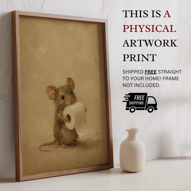 May include: A framed artwork print featuring a brown mouse holding a roll of white toilet paper against a textured beige background. The print is displayed next to a small white vase. The text reads: THIS IS A PHYSICAL ARTWORK PRINT.