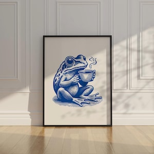 May include: A blue illustration of a frog sitting and holding a steaming cup of coffee. The frog is drawn in a vintage style.