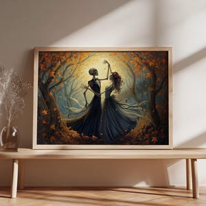 May include: A rectangular framed wall art print featuring an illustration of two skeletons dancing in a forest filled with autumn leaves. The skeletons are dressed in formal attire, with one wearing a dark suit and the other a dark flowing gown.