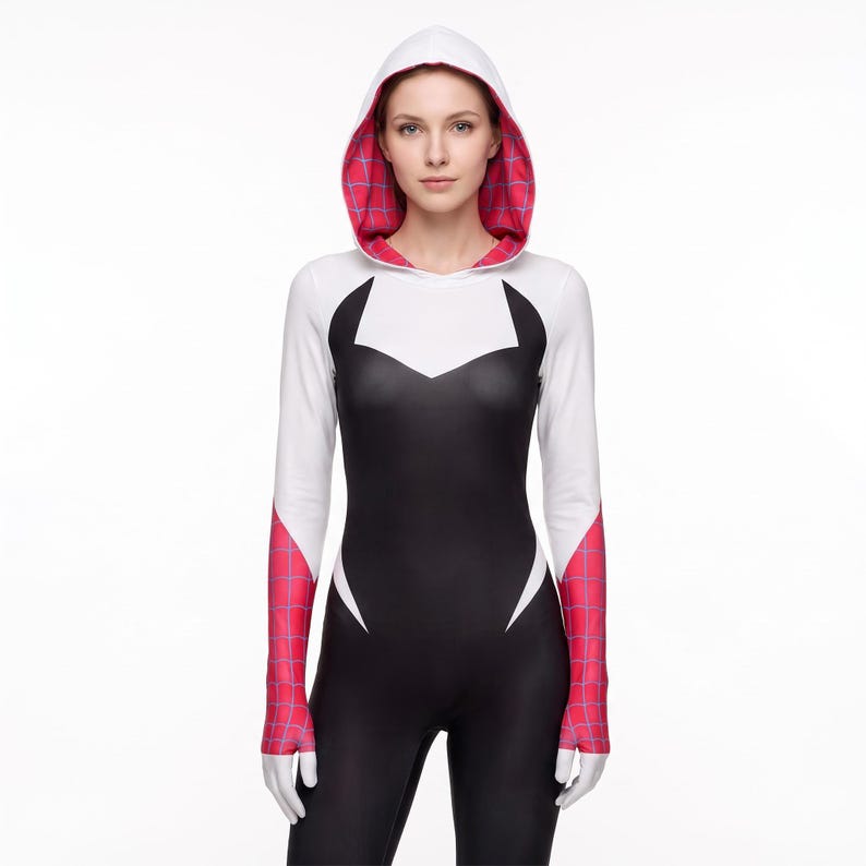 May include: A long-sleeved hooded bodysuit featuring a black torso, white upper chest and sleeves, and pink web-patterned accents on the hood interior and lower sleeves. The garment has a fitted silhouette with a pointed white neckline detail.