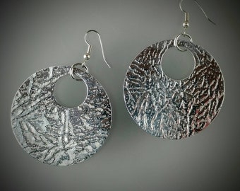 Jemsetter.Super large aluminum disc drop earrings. Discs are 1 7/8 Inches in diameter. Surgical steel french hook ear wires.jemsetter.