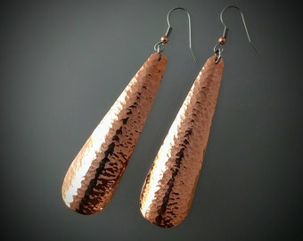 Copper long dangle drop earrings, 2 5/8 in. long, 3/4 in. wide, hand hammered, real nice texture to catch the light as they move.jemsetter