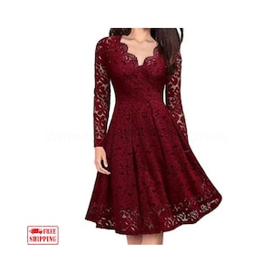 May include: A burgundy lace dress with long sleeves and a V-neckline. The dress has a fitted bodice and a flared skirt, creating an elegant silhouette. The lace pattern is intricate, adding texture and detail to the garment. The dress is suitable for formal occasions.