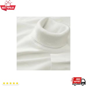 May include: Close-up of a white turtleneck sweater. The ribbed collar and cuff details are visible. The sweater is made of a soft, likely knit material. The image is well-lit, highlighting the texture and color of the garment. The words "Most Popular" are in a red banner.