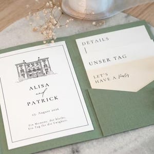 May include: A sage green gatefold invitation card featuring a black line drawing of a building, the names Alisa and Patrick, and the date 23. August 2026. Inside, cream-coloured inserts display the text Details, Unser Tag, and Let's Have a Party.
