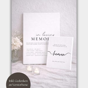 May include: Two white rectangular memorial signs with black text. The larger sign reads in loving memory and lists names. The smaller sign reads to all of our loved ones dancing with us in heaven. Both signs feature elegant serif and script typography.